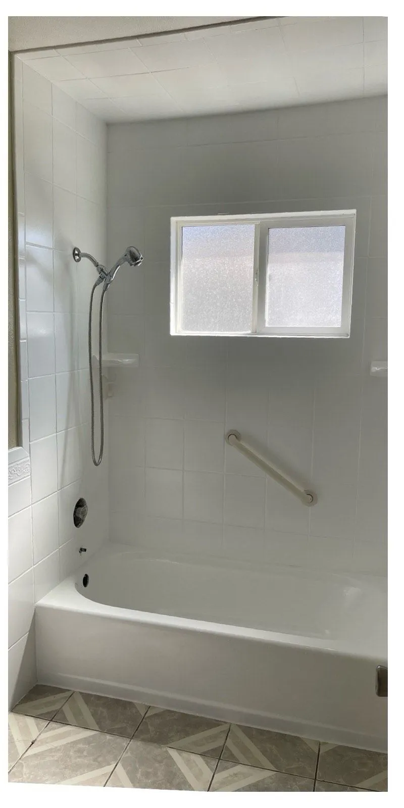 After: Tub and gray tile surround masked for refinishing beside the same surround refinished in clean white